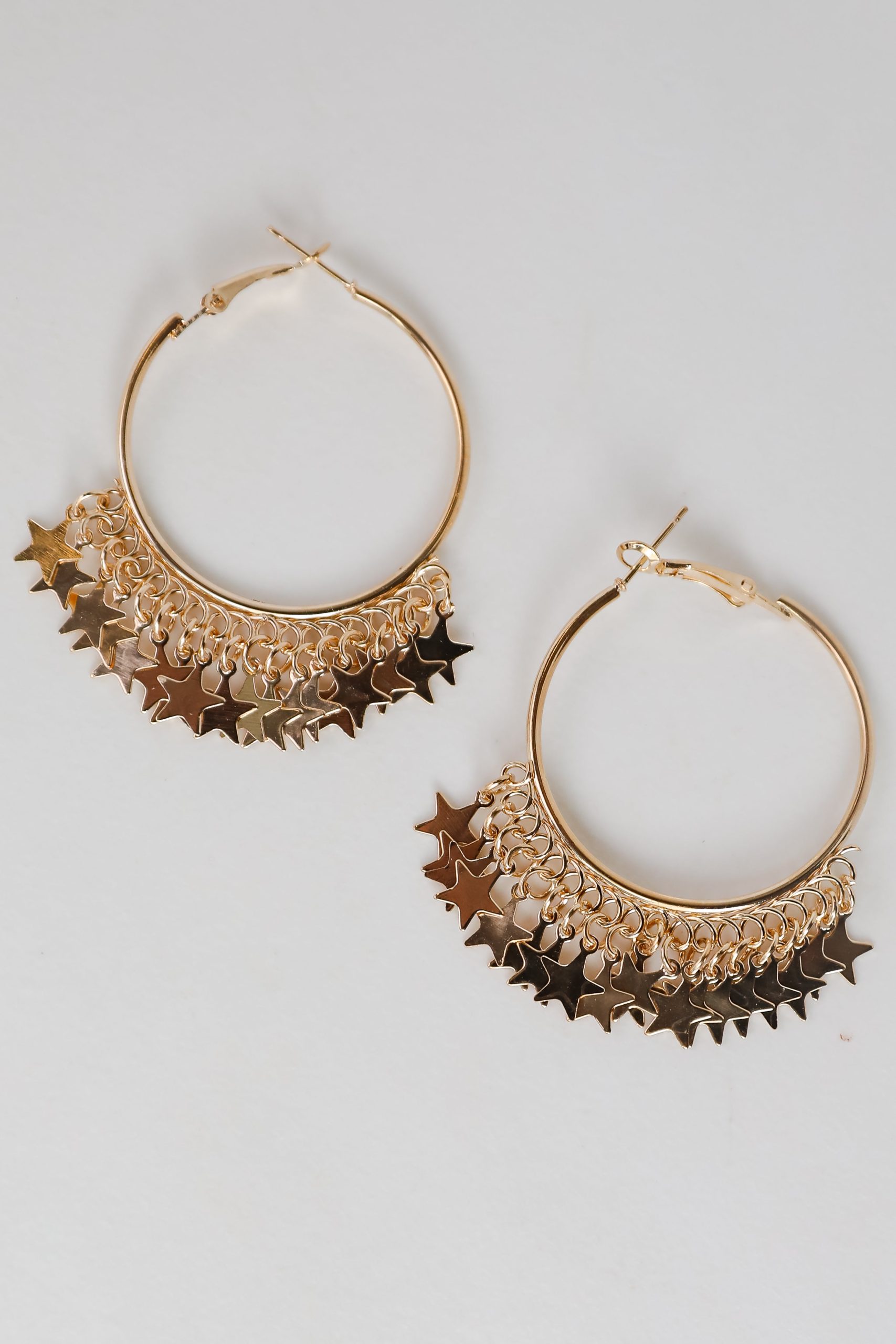 shopdressup_gold_star_hoop_earrings-2_7c77b5eb-e806-48b7-89e0-5302420c80d2.jpg